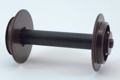 A Schacht Spinning Wheel Travel Bobbin by Schacht Spindle Co., featuring a cylindrical black body with brown circular ends, lies horizontally against a plain white background. The ends have ridged edges, and one side has a small central extension.