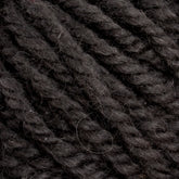 Close-up of the dark grey Halcyon Yarn Classic Rug Wool | Strand by Caledonian Dye Works twisted into a thick, textured strand. The individual fibers are visible, showcasing the natural, slightly fuzzy texture. Hand-dye techniques provide it with a unique hue. The yarn boasts a consistent twist throughout, making it perfect for knitting, crochet projects or rug weavers alike.