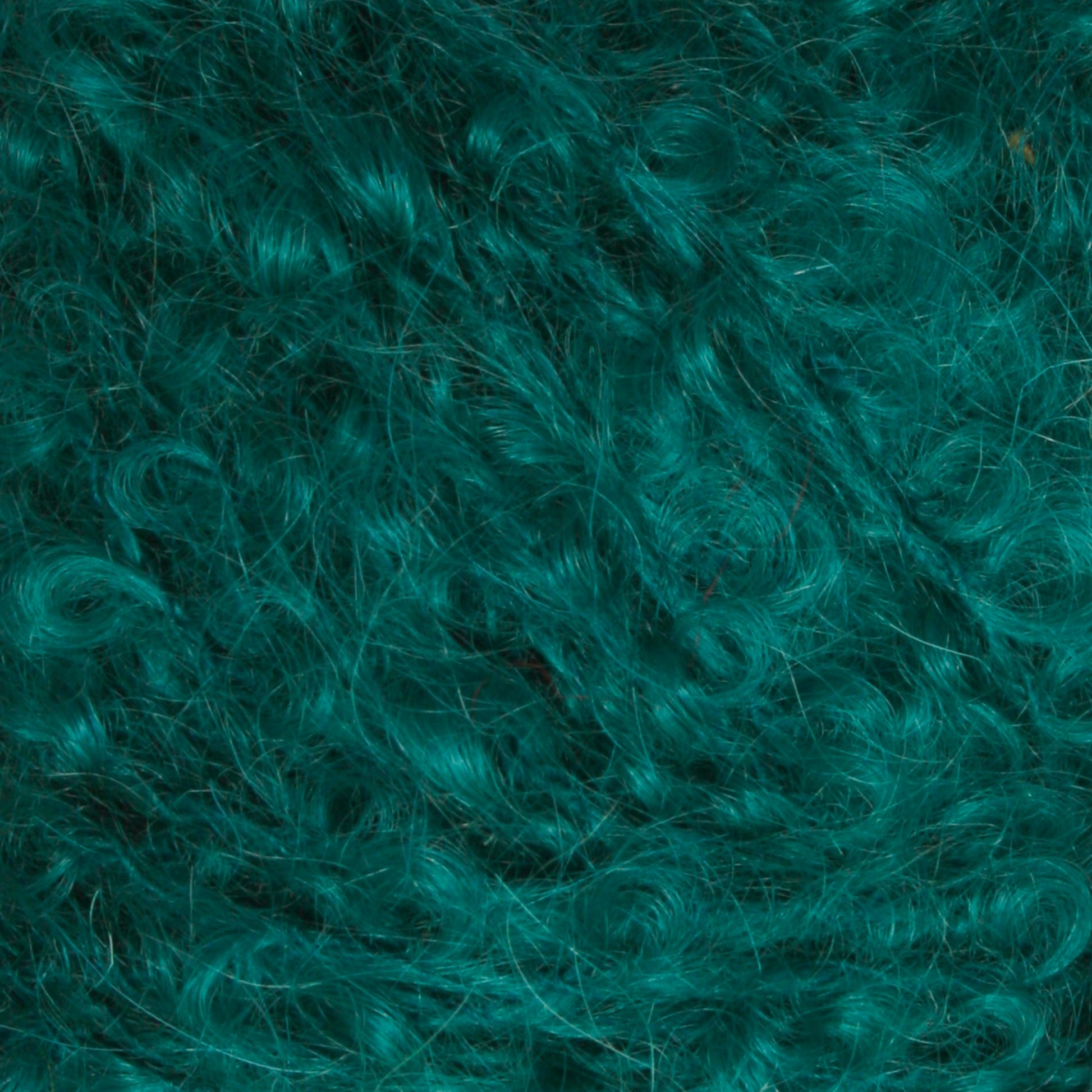 A close-up view of a textured surface covered in bright teal fibers from Caledonian Dye Works' Victorian Bouclé Mohair Yarn. The fibers are wavy, tangled, and have a very plush and soft appearance, resembling fluffy yarn or mohair bouclé.