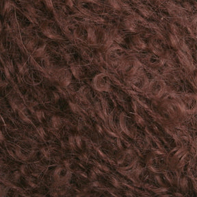 Close-up image of curly hair in a rich, reddish-brown color. The texture appears dense and tightly coiled, reminiscent of Victorian Bouclé Mohair Yarn from Caledonian Dye Works, filling the entire frame and showcasing the natural curls and waves.