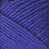 Close-up of thick, soft Brown Sheep Lamb's Pride Worsted Yarn in a vibrant purple color. The strands have a slightly fuzzy texture and are tightly wound, filling the entire frame. Perfect for felting projects, the yarn is coiled to showcase its rich color and smooth surface.