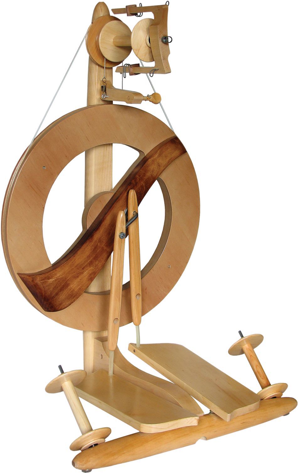 The Kromski Fantasia Spinning Wheel by Kromski North America is a wooden spinning wheel with a modern double drive wheel design. It features a large circular wheel, two foot pedals, and various smaller components, including Kromski bobbins and hooks. The spinning wheel boasts a sleek natural wood finish with darker wood accents.