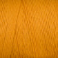 Close-up image of Maurice Brassard's Cotton 8/8 Carpet Warp in a bright orange color. The strands are tightly wound together, showcasing their smooth texture and slight sheen. The vibrant hue and detailed fibers of the unmercerized cotton yarn are clearly visible, making it perfect for knitting and crochet projects.