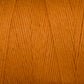 Close-up image of a spool of Maurice Brassard's Cotton 8/8 Carpet Warp. The strands are tightly wound together, showcasing the texture and thickness of the unmercerized cotton yarn. The vibrant orange hue is consistent throughout the thread, providing a warm and energetic feel, perfect for knitting and crochet projects.