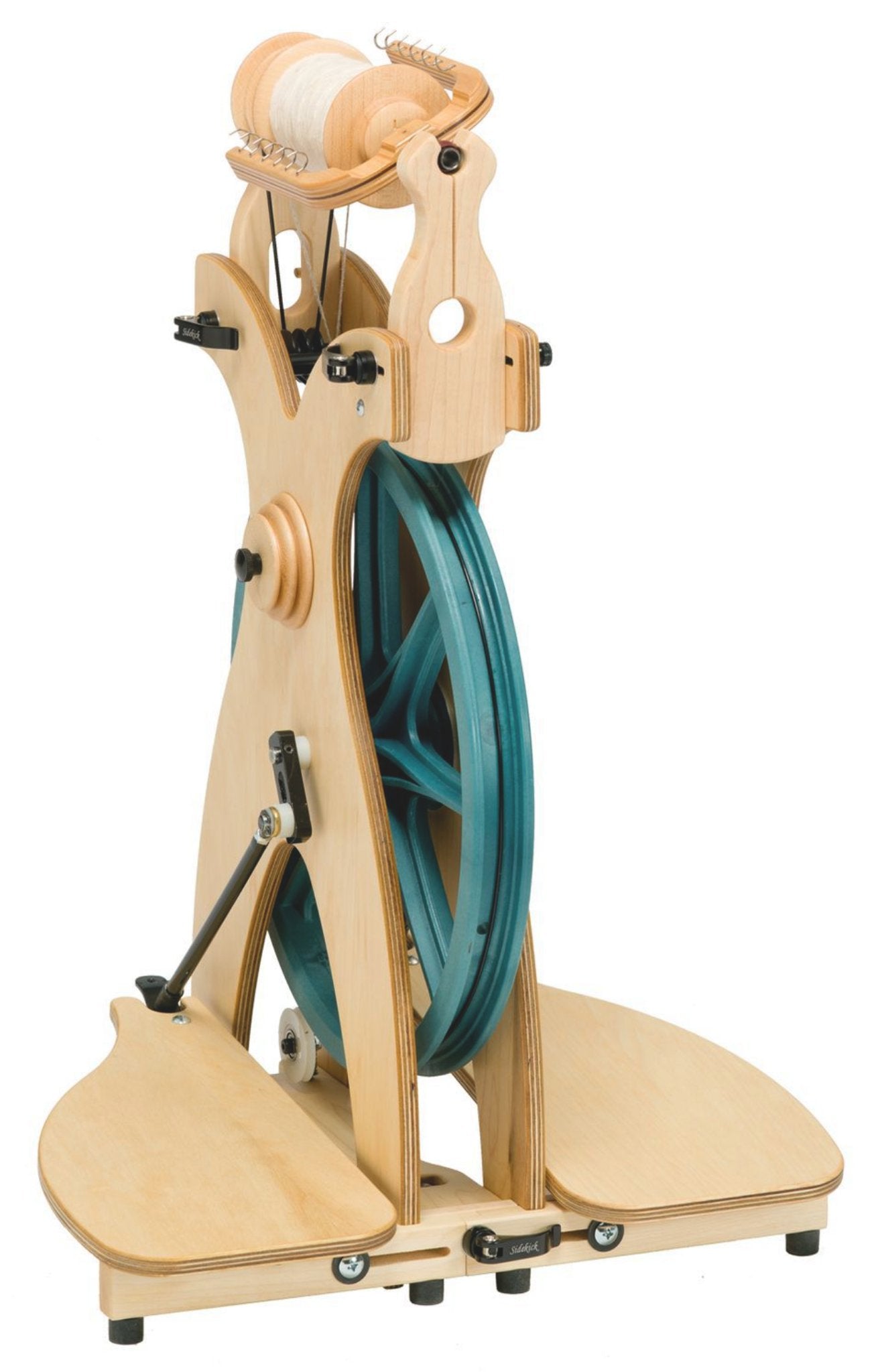 The Schacht Sidekick Spinning Wheel - Complete by Schacht Spindle Co. is a sleek, wooden spinning wheel with a modern design, featuring a large blue wheel, two pedals, and a compact structure. It boasts thread spools and hooks for guiding yarn and is perfect as a lightweight folding wheel for any portable spinner.