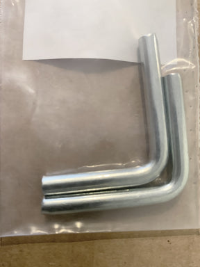 Two metal Allen wrenches are placed in a clear plastic bag. The bag is sealed and positioned on a beige surface, possibly a tabletop. A white label, often seen with Louët Treadle Hinge - per 2 from Louët Inc., is partially visible at the top of the bag.