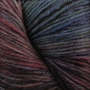 A close-up view of Malabrigo Yarn's Malabrigo Arroyo multicolored sport weight superwash merino wool yarn reveals shades of dark green, blue, purple, and red expertly intertwined. The tightly twisted fibers showcase a rich, variegated texture perfect for lightweight garments.