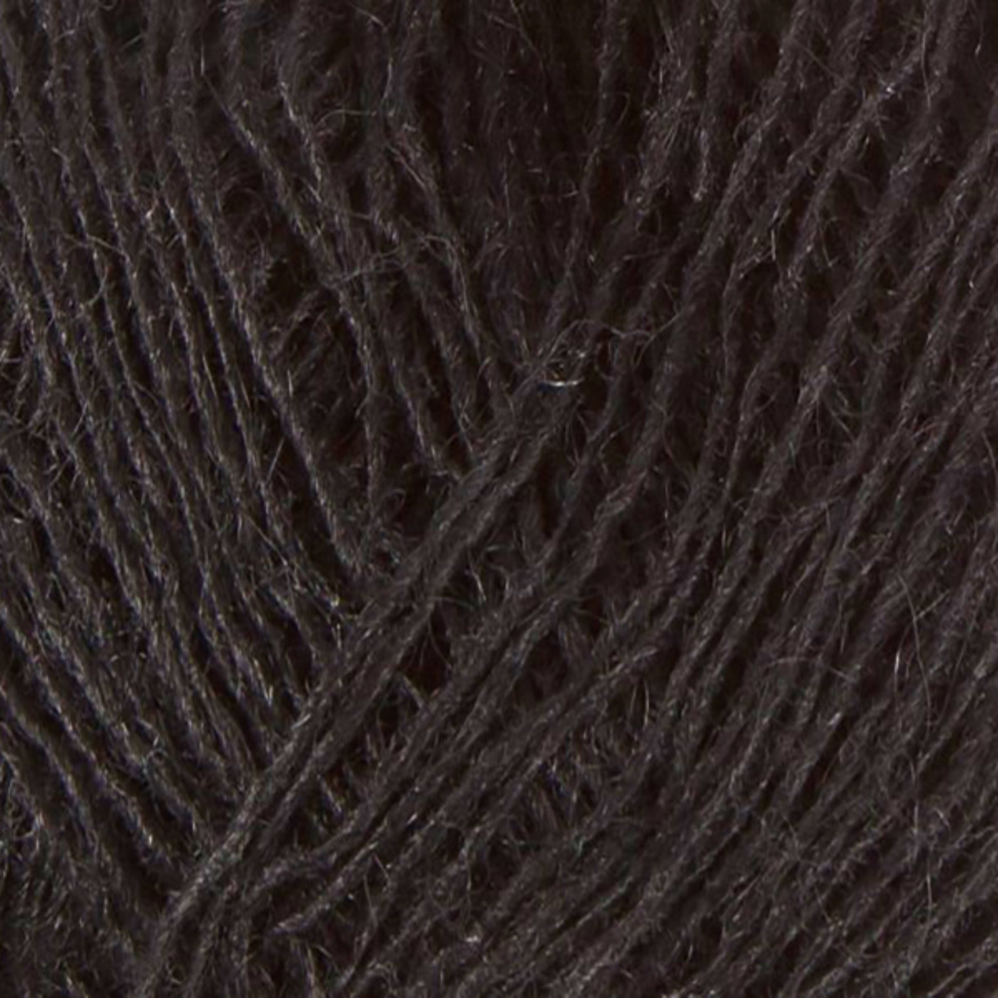 Close-up image of black Einband Lopi yarn by Berroco, Inc. The fibers appear soft and slightly fuzzy, with interwoven strands creating a textured pattern perfect for stranded colorwork.