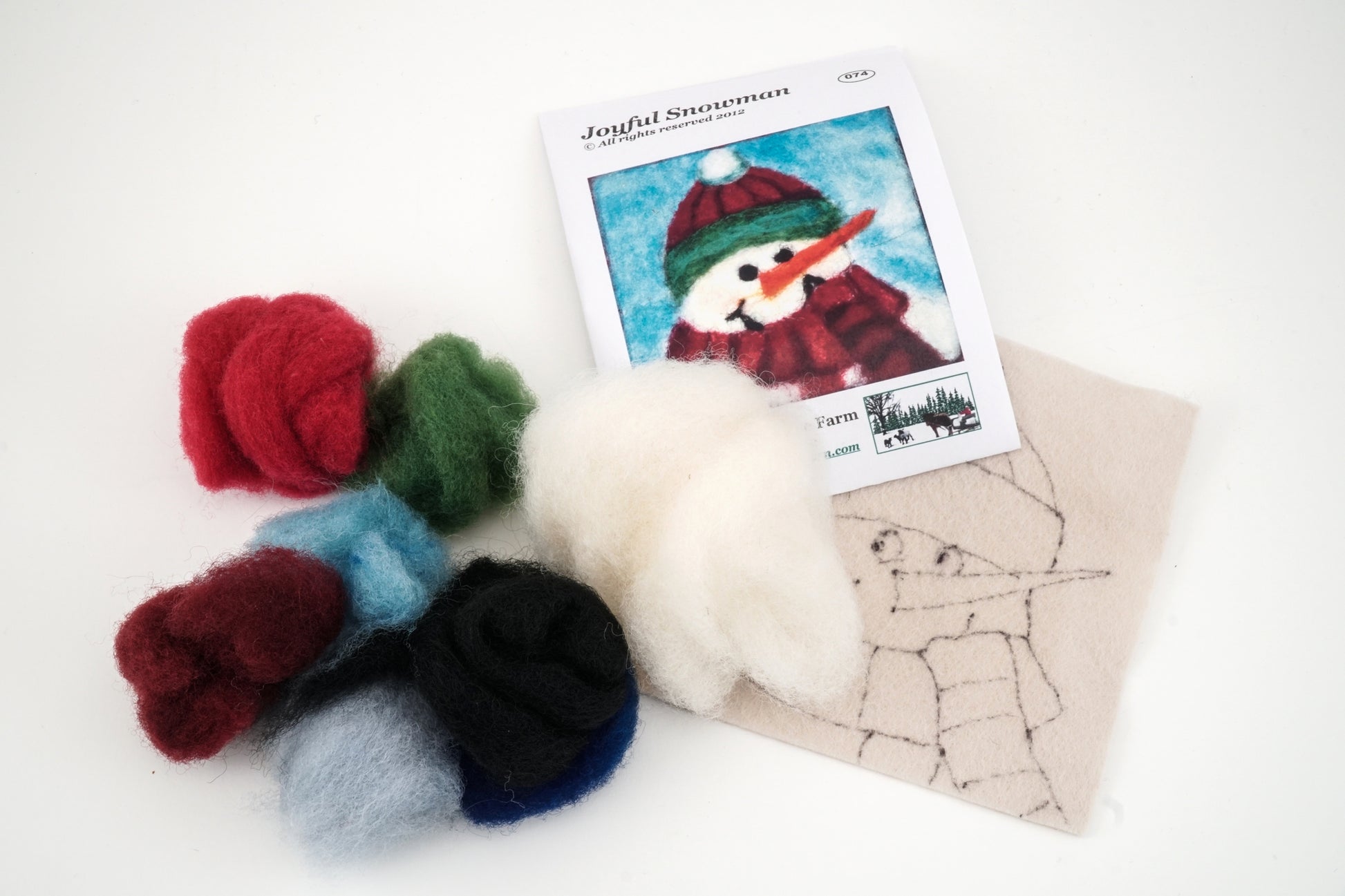 The Thyme Tile Felting Kit (no tools) by A Wrinkle in Thyme Farm is perfect for beginner felters and includes wool roving in six vibrant colors (red, green, white, dark brown, light blue, dark blue), a piece of felt with an outlined snowman drawing, and an instruction booklet showcasing a completed snowman picture on the cover.