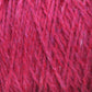 Close-up image of a tangled bundle of unscoured magenta yarn. The texture is soft and slightly fuzzy, with intertwined strands of varying shades of pink and purple, showcasing the detailed fibrous structure woven in Harrisville Designs' Harrisville Highland - Cones style.