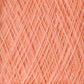 Close-up image of tightly wound, soft, peach-colored Jagger Brothers, Inc. JaggerSpun Maine Line 3/8 Yarn on a large cone. The strands intersect diagonally, creating a geometric pattern. The texture appears fluffy and fibrous, with a warm, inviting hue characteristic of soft medium-grade wool.