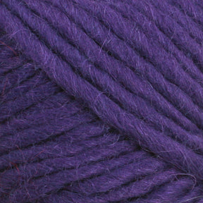 Close-up of Lamb's Pride Bulky Yarn by Brown Sheep, showcasing its soft and thick texture with individual fibers and strands clearly visible, indicating its suitability for knitters and crocheters working on projects like woven blankets or Icelandic sweaters.