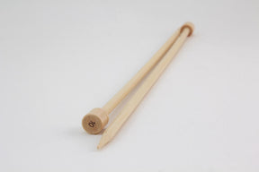 A pair of Bamboo Single-Point Knitting Needles from Accessories Unlimited rests on a white surface. One end of each 12" needle is blunt, while the other end is pointed. The cap of the nearest knitting needle is marked with the number "10".