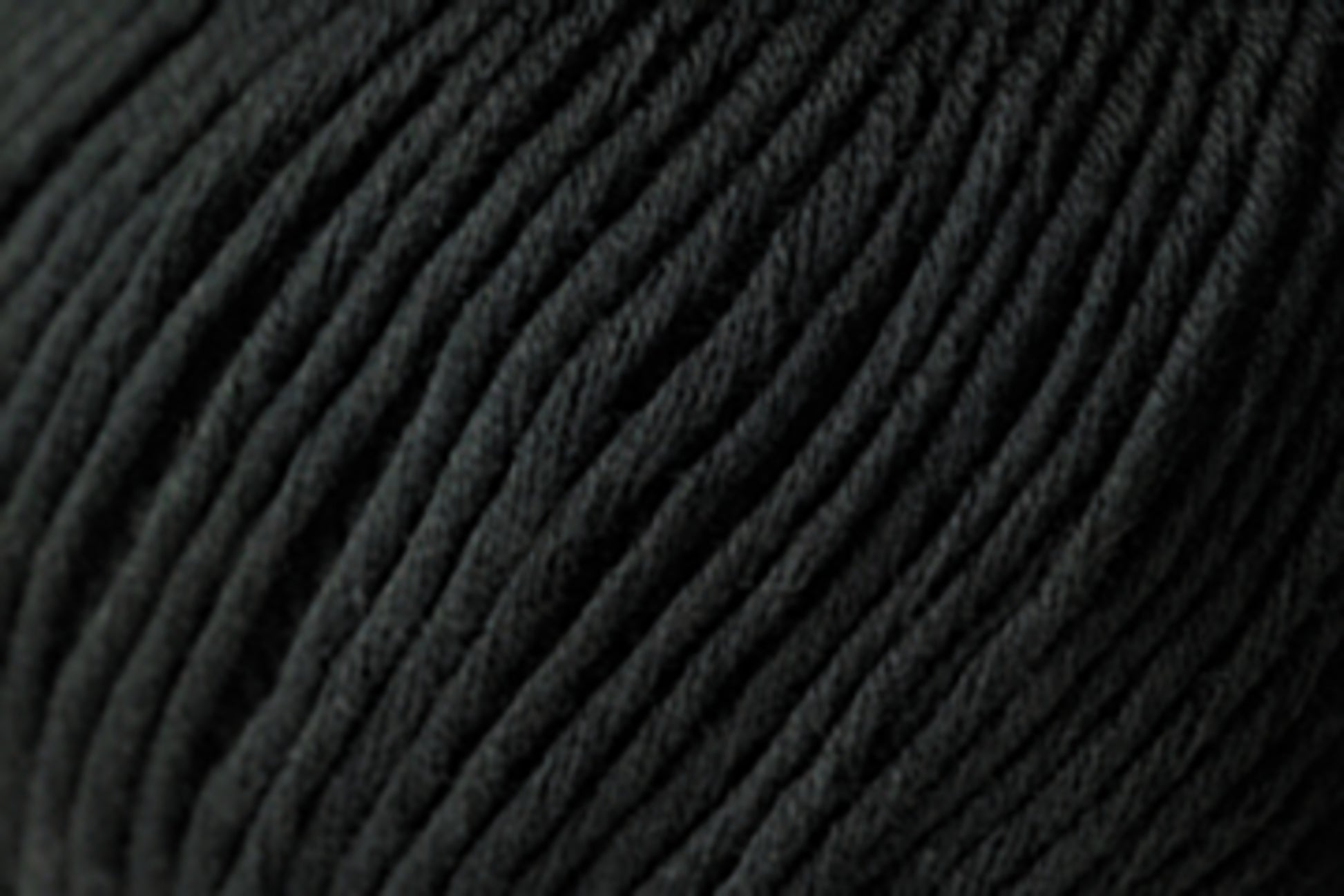 Close-up image of black, tightly ribbed fabric crafted from Jo Sharp Soho Summer DK Cotton by Kingfisher Yarn & Fibre, showing the detailed texture of the material. The fabric appears soft and flexible, with parallel lines creating a striped pattern. This lightweight cotton is perfect for summer garments.