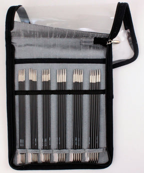 A black zippered case is open to reveal a set of graphite pencils arranged in two rows. The pencils are neatly organized, with the pointed ends facing up, reminiscent of the Accessories Unlimited Karbonz Double Point 6" Sock Needle Set. The case has a transparent flap with a zipper pull on the right side.