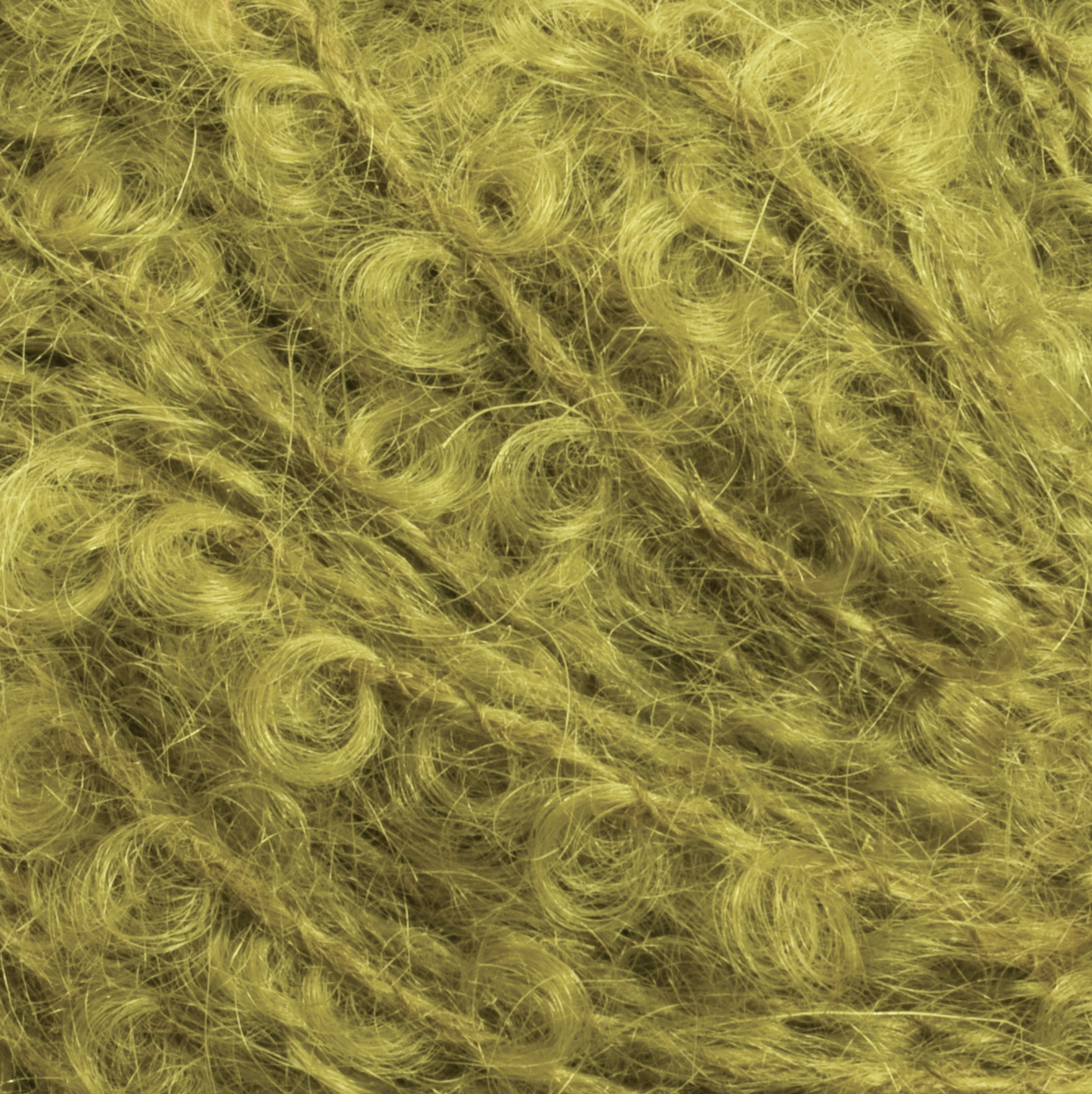 Close-up image of a textured surface featuring curly, thread-like fibers in a vibrant yellow-green shade. The curls and loops interweave, creating a dense, intricate pattern reminiscent of Victorian Bouclé Mohair Yarn from Caledonian Dye Works' Signature Victorian Collection.