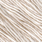 The close-up image showcases strands of Henry's Attic Soft Twist Natural Silk Yarn. This yarn consists of twisted natural fibers, appearing soft and slightly uneven in thickness, creating a textured background. The colors range from off-white to pale beige, giving it a natural and organic look perfect for hand washing.