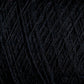 Close-up image of JaggerSpun Maine Line 2/20 Yarn by Jagger Brothers, Inc. in black, wound into a ball, showcasing detailed texture and fibers. The worsted spun yarns appear tightly wound and exhibit a smooth, consistent appearance.