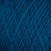 Close-up image of dark blue JaggerSpun Maine Line 2/20 Yarn from Jagger Brothers, Inc., showing detailed intertwining fibers and texture. The medium-grade wool threads are tightly wound, creating a dense and intricate pattern on the large cone.