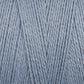 Close-up of soft, light blue 16/2 Bamboo Yarn by Maurice Brassard, neatly arranged in a parallel pattern, showcasing a smooth texture and a slightly shiny appearance. This sustainable yarn is suitable for knitting or crocheting projects and boasts antibacterial properties.