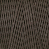 A close-up image of the #9 Cotton Lacing Cord from Stuart C. Hurlbert & Co. The dark brown fibers are neatly wound together in a crisscross pattern, reminiscent of the meticulous work of rug braiders, showcasing the texture and thickness of the cord.