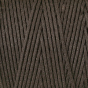 A close-up image of the #9 Cotton Lacing Cord from Stuart C. Hurlbert & Co. The dark brown fibers are neatly wound together in a crisscross pattern, reminiscent of the meticulous work of rug braiders, showcasing the texture and thickness of the cord.