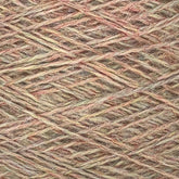 Close-up image of a spool of JaggerSpun Heather 3/8 yarn by Jagger Brothers, Inc., in muted earth tones including light brown, beige, and hints of green. The wool yarn is tightly wound, highlighting its texture and the interwoven strands.