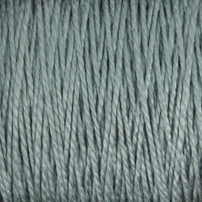 Close-up image of 10/2 Pearl Cotton Yarn | Mini-cone by Supreme Corp. in light grey, showcasing tightly twisted strands running vertically. The yarn's soft and slightly shiny texture indicates its high quality, making it suitable for knitting or crochet projects. Its versatile composition ensures colorfastness, making it ideal for various crafts.