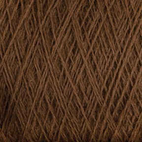 Close-up view of dark brown yarn wound into a ball, showcasing its texture and fiber details. The Jagger Brothers, Inc. JaggerSpun Maine Line 3/8 Yarn on this large cone is tightly wound, creating a crisscross pattern of overlapping threads.