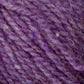 Close-up image of a textured Bartlettyarns Bartletts Maine Wool - Sport in purple. The strands are intertwined, exhibiting varying shades of purple with some blue and white fibers interspersed, creating a rich and detailed pattern.