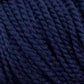 Close-up of Norumbega navy blue yarn by Caledonian Dye Works, showing the twisted strands and fibers in detail. Made from 100% U.S. wool, the texture appears soft and slightly fuzzy, with tight, consistent twists that create a uniform appearance. This Aran weight yarn promises to deliver a durable fabric for your projects.