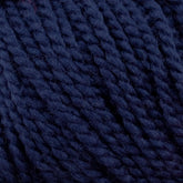 Close-up of Norumbega navy blue yarn by Caledonian Dye Works, showing the twisted strands and fibers in detail. Made from 100% U.S. wool, the texture appears soft and slightly fuzzy, with tight, consistent twists that create a uniform appearance. This Aran weight yarn promises to deliver a durable fabric for your projects.