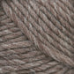 A close-up image of Lamb's Pride Bulky Yarn by Brown Sheep reveals thick, brown threads with visible fibers interwoven in a tight, textured pattern. Reminiscent of the quality seen in Icelandic sweaters, this yarn boasts a consistent hue with some variations and a slightly fuzzy appearance. Perfect for knitters and crocheters seeking premium material.