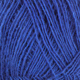 Close-up image of a tangled ball of Einband Lopi royal blue yarn from Berroco, Inc., showing the intricate and textured strands woven together randomly. The yarn threads appear soft and slightly fuzzy, perfect for delicate lace knitting projects.