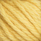 Close-up of the soft, thick fibers of Halcyon Yarn Classic Rug Wool by Caledonian Dye Works. The yellow strands are loosely twisted together, creating a fluffy texture reminiscent of traditional rug wool used by skilled weavers. The bright yellow color appears uniform throughout, highlighting the skein’s fibrous and slightly fuzzy surface.