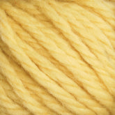 Close-up of the soft, thick fibers of Halcyon Yarn Classic Rug Wool by Caledonian Dye Works. The yellow strands are loosely twisted together, creating a fluffy texture reminiscent of traditional rug wool used by skilled weavers. The bright yellow color appears uniform throughout, highlighting the skein’s fibrous and slightly fuzzy surface.