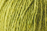 Close-up image of a textured ball of Jo Sharp Silkroad DK Tweed yarn from Kingfisher Yarn & Fibre, showcasing its fibrous and slightly irregular surface that hints at its natural materials. The vibrant shade of green highlights the premium blend of wool, silk, and cashmere in this luxurious DK weight yarn.