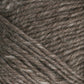 Close-up image of Brown Sheep's Lamb's Pride Worsted Yarn in a brown and beige speckled colorway. The tightly twisted yarn strands create a textured pattern, and the fibers appear soft and slightly fuzzy, making it ideal for knitting or crocheting felting projects.