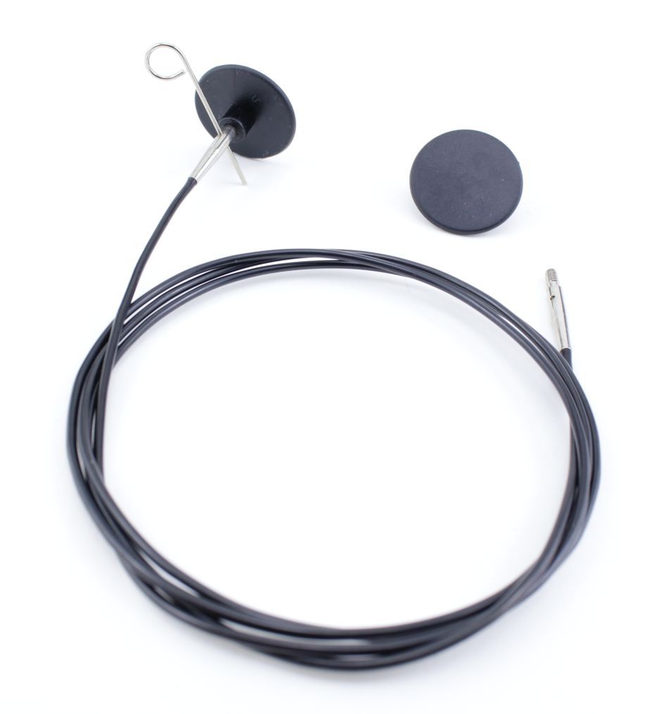 A black magnetic cable from Accessories Unlimited's Interchangeable Circular Needle Cord for Dreamz and Nova, featuring a disc-shaped attachment on one end and a straight connector on the other, captured alongside an additional black disc-shaped magnetic accessory, all set against a white backdrop.