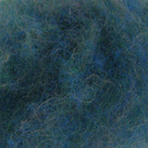 A close-up view of a mass of blue and green tangled fibers, resembling Harrisville Dyed & Carded Wool Fiber by Harrisville Designs. The fibers are intertwined, creating a chaotic and dense texture with heathered colors. The image appears abstract and does not depict any recognizable objects or forms.