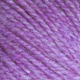 Close-up image of Bartlettyarns' Maine Wool Yarn in purple, highlighting its soft, fuzzy texture and interwoven fibers. This worsted weight yarn from Bartlettyarns features varying shades of purple, creating a slightly heathered effect.