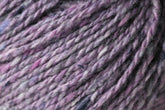 Close-up of a skein of Jo Sharp Silkroad DK Tweed by Kingfisher Yarn & Fibre, showcasing a blend of purple, pink, and gray fibers. The wool yarn appears soft and textured, with visible twists and subtle color variations throughout.