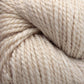 Close-up of off-white Acadia by The Fiber Company yarn twisted into a skein. The fibers are thick and slightly textured, tightly twisted together, showcasing the natural variation in the wool's color and texture, which creates a subtle tweed effect for a soft and cozy appearance. This product is crafted by The Fibre Co. (UK) Ltd.