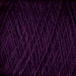 Close-up image of a bundle of dark purple JaggerSpun Maine Line 3/8 Yarn | Mini-cone from Jagger Brothers, Inc., showcasing the texture and intertwined strands typical of Maine wool yarns. The dense, fibrous pattern reveals rich, deep colors with threads overlapping in various directions.