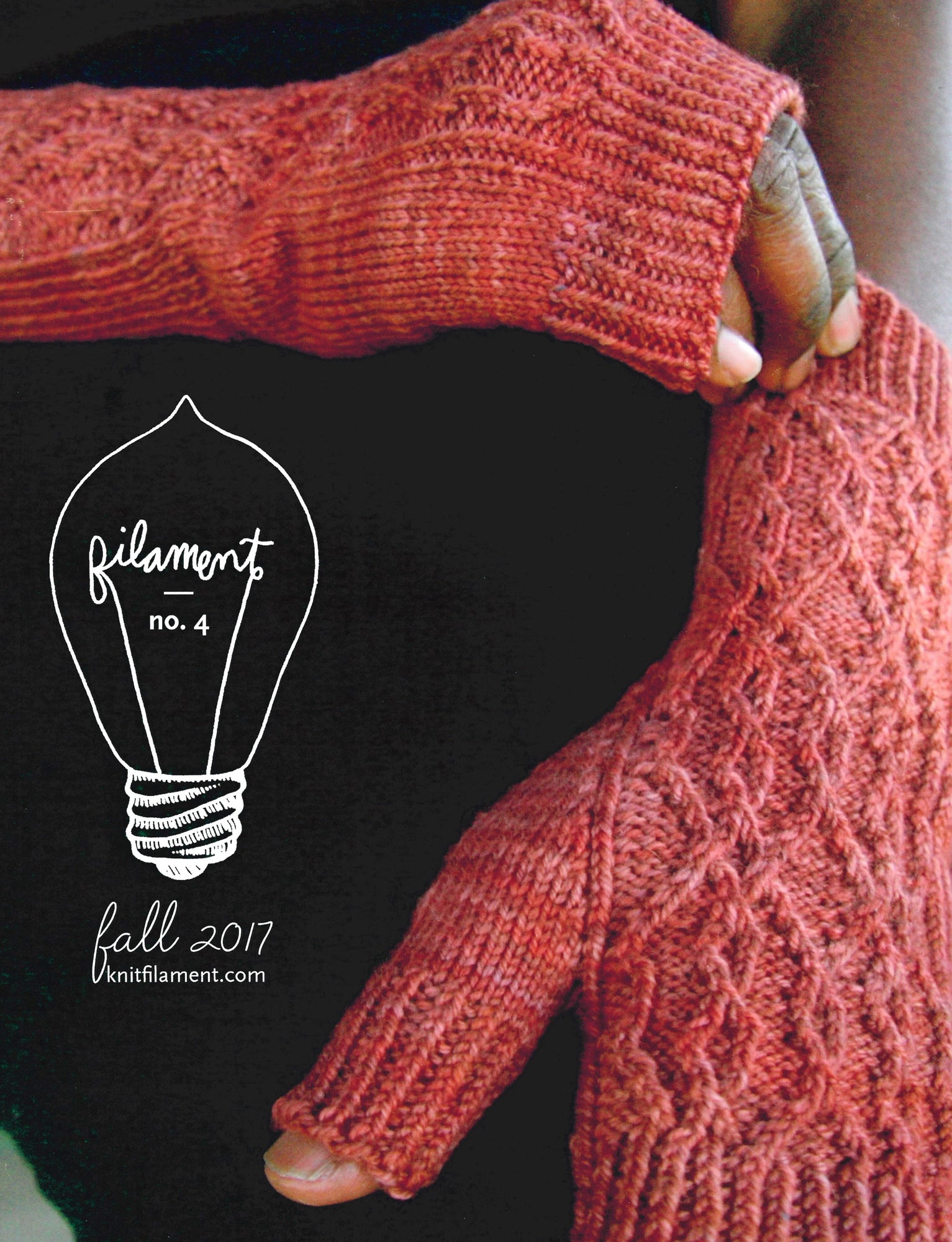 Close-up of a person wearing red knitted fingerless gloves, holding their arm. The text reads "Filament No. 4" inside a light bulb outline and "Fall 2017 Knit Filament" below. A stylish addition to women's garments featured in Knit Filament's quarterly publication.