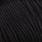 Close-up image of tightly wound, dark-colored Cotton Fleece by Brown Sheep, showing the detailed texture and strands of the material. The color appears to be a deep black, highlighting the twists and fibers in the yarn, making it perfect for intricate knitting patterns.