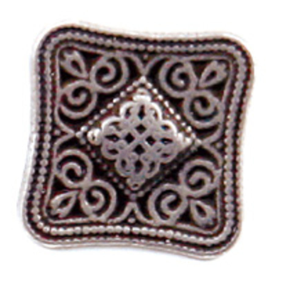 The Tin Celtic Square Button from Dill Buttons of America, Inc is a square silver button with rounded edges, adorned with intricate swirls and beaded patterns. At its center is a diamond-shaped, interwoven knot design. This button boasts a vintage, ornate appearance with a subtle pewter-look metal finish.