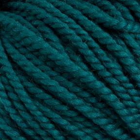 Close-up image of tightly wound, teal-colored Norumbega Aran weight yarn strands from Caledonian Dye Works. The texture showcases the 100% U.S. wool's soft and slightly fuzzy surface, twisted into thick, consistent ropes. The overall appearance is vibrant and richly hued.