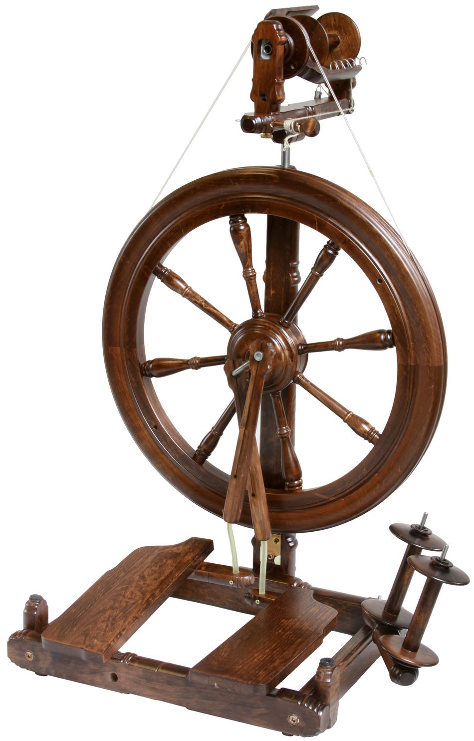 The Kromski Sonata Double-Treadle Spinning Wheel by Kromski North America boasts a rich, polished dark wood finish. It features a sizeable wheel with six spokes, two foot pedals, and various finely crafted wooden components for spinning fibers into thread. The intricate design exhibits a classic, vintage charm that epitomizes the timeless elegance of Kromski wheels.