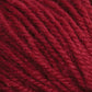 Close-up image of Halcyon Deco Rug Wool in deep red, showcasing the individual fibers and strands twisted together in a thick, cozy texture. This 100% wool yarn by Caledonian Dye Works has a soft, slightly fuzzy appearance, making it suitable for various knitting or crocheting projects.